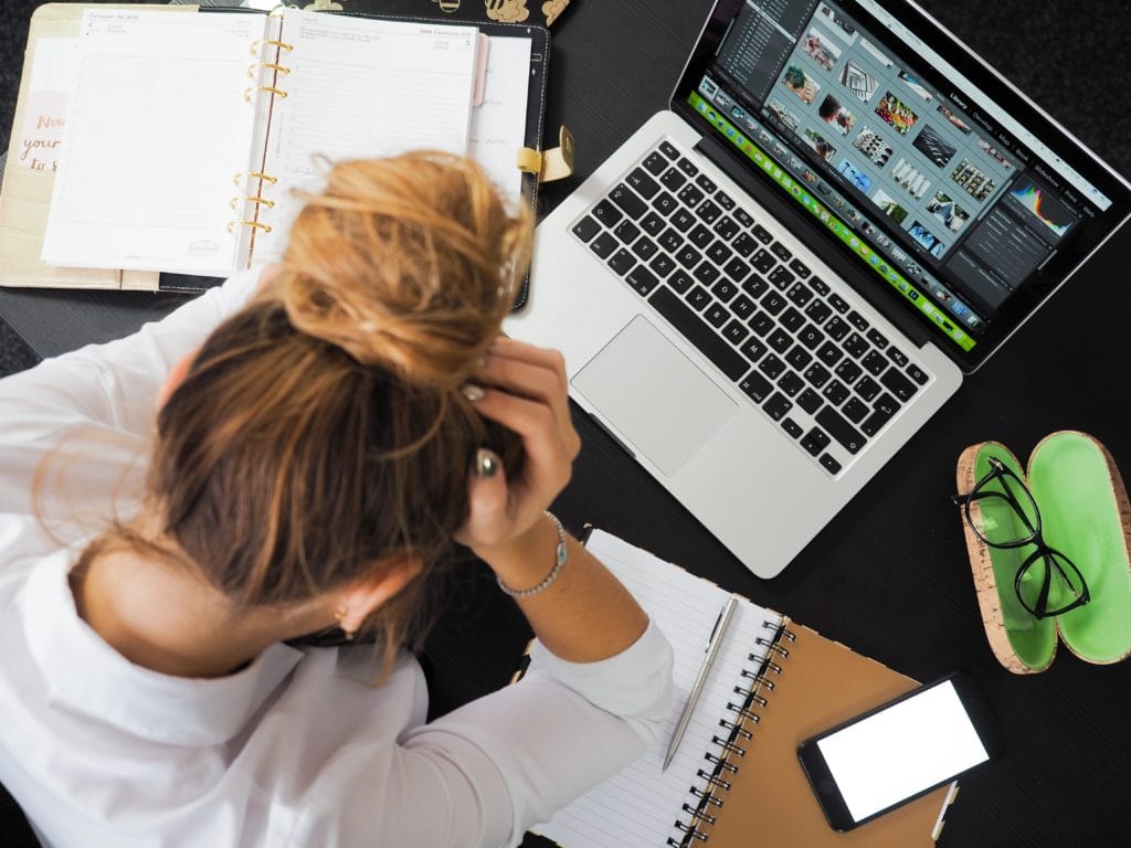 Burnt Out Woman Sitting in Front of Computer 