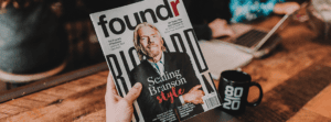 Man Holding Foundr Magazine With Richard Branson on Cover