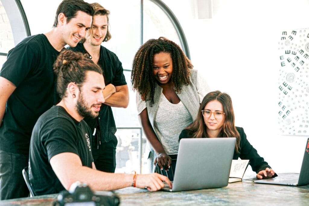  Company Employees Looking at Laptop During Learning and Development Session