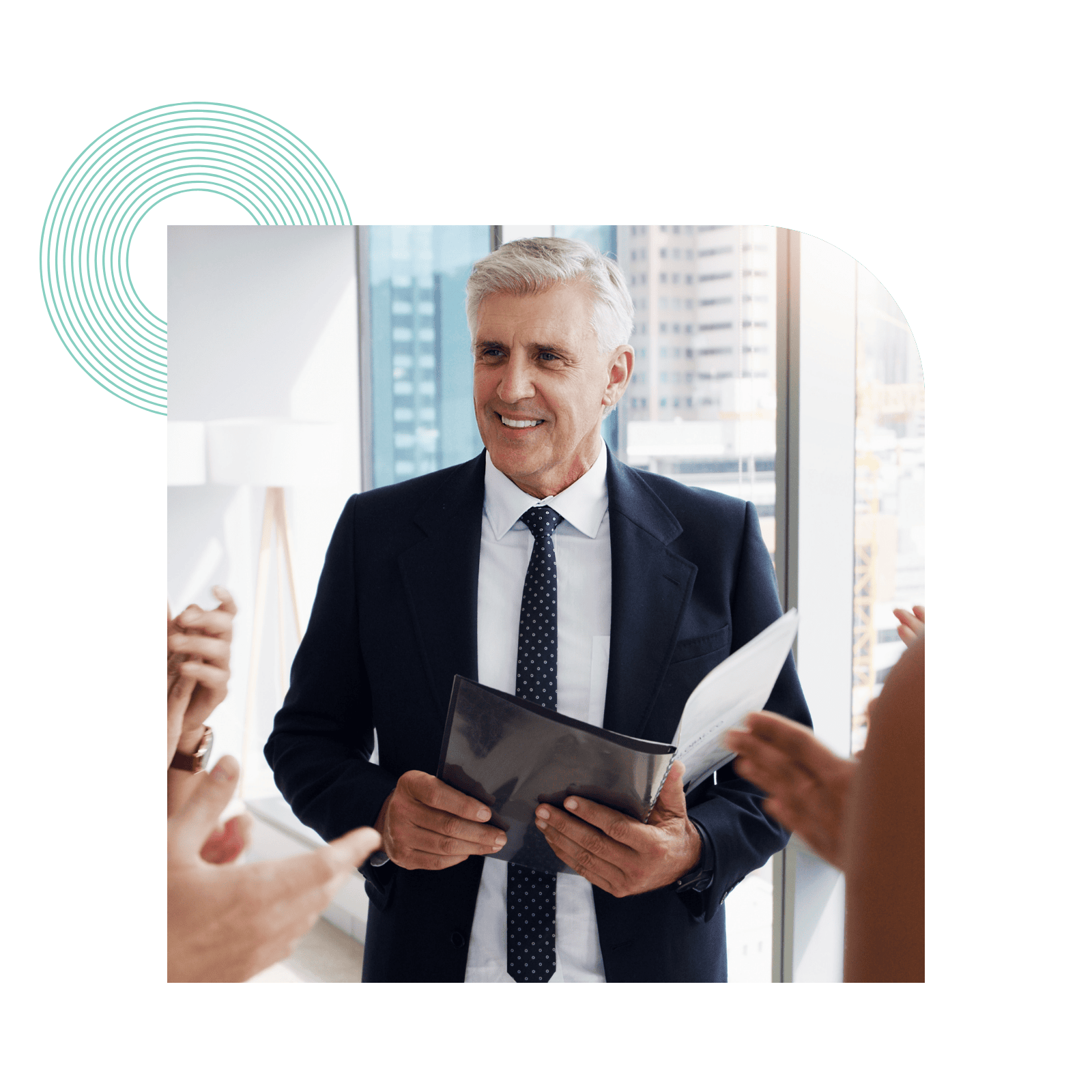 Man holding a folder talking to colleagues